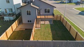 Grande Prairie apartment for rent - A house with a grey roof and a wooden deck.