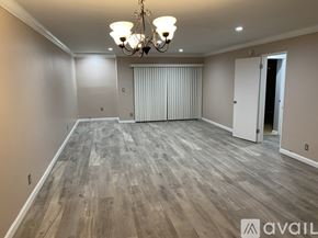 Culver City apartment for rent - A room with wooden flooring and a chandelier.