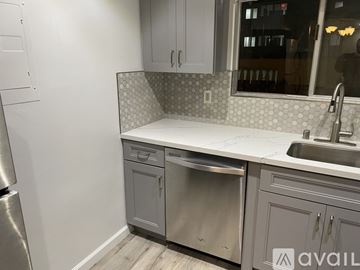 Culver City apartment for rent - A kitchen with a stainless steel refrigerator and a white countertop.