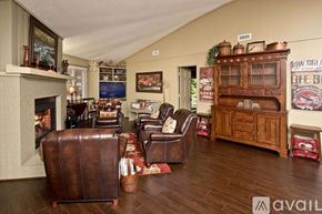 Sky Valley house for rent - A living room with a fireplace and leather chairs.