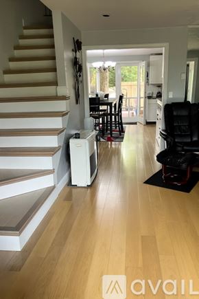 Laconia townhouse for rent - A dining room with a table set for six.
