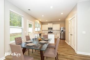 Antioch house for rent - A dining room with a glass table and chairs.