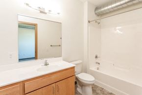 Waterloo apartment for rent - A white bathroom with a toilet, sink, and bathtub.