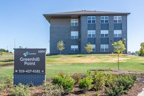 Waterloo apartment for rent - A sign for Greenhill Point with a building in the background.