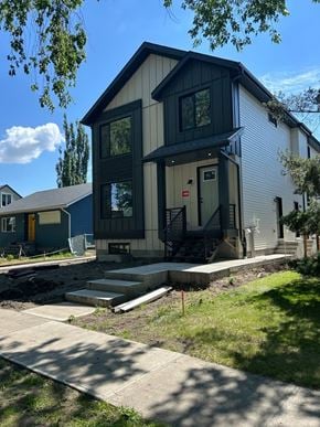 Edmonton apartment for rent - A modern house with a blue and white exterior.