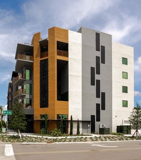 Dania Beach apartment for rent - A modern building with the word "KOUSH" on the side.