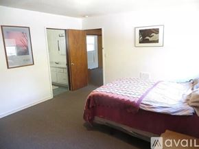 Fall River Mills apartment for rent - A bedroom with a bed, dresser, and mirror.