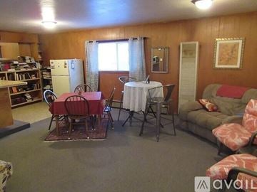 Fall River Mills apartment for rent - A living room with a dining table set up with chairs and a couch.