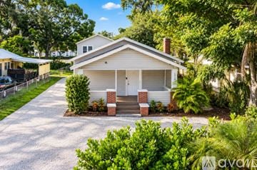 Bradenton house for rent - A kitchen with white cabinets and appliances.