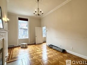Boston apartment for rent - A room with a desk and a bed in it.