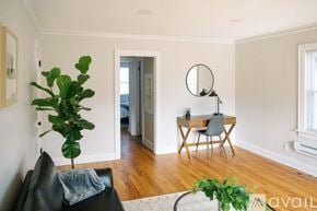 Des Moines apartment for rent - A room with a desk, chair, mirror, and a television.