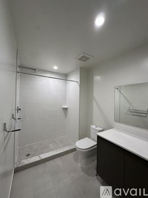 Oakland Park apartment for rent - A bathroom with a toilet, sink, and shower.