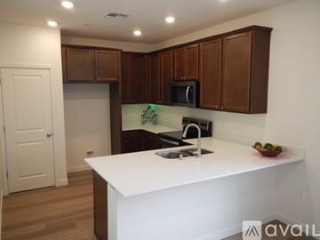 Antelope house for rent - A kitchen with brown cabinets and a white counter.
