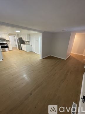 Centre Hall house for rent - A room with wooden flooring and white walls.