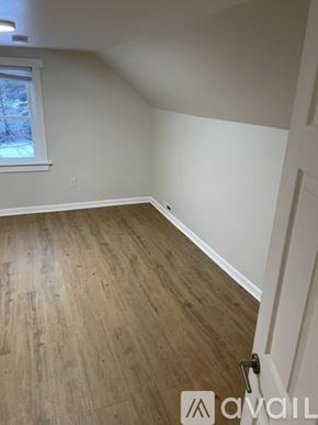 Centre Hall house for rent - A room with wooden flooring and a window.