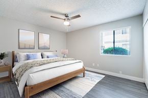 Mesa apartment for rent - A bedroom with a large bed and a ceiling fan.