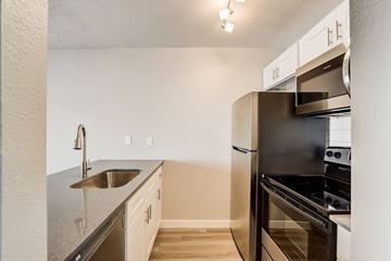 Phoenix apartment for rent - A kitchen with a stainless steel sink and oven.