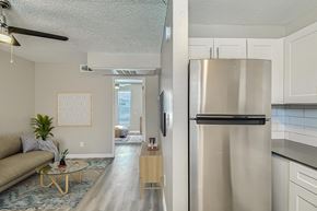 Glendale apartment for rent - A kitchen with white cabinets and a black oven.