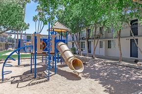 Tempe apartment for rent - A playground with a slide and a sandbox.