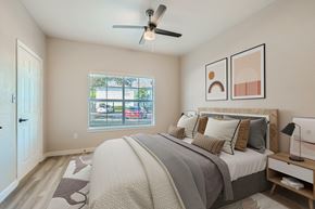 Northlake apartment for rent - A bedroom with a large bed and a ceiling fan.