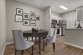 Northlake apartment for rent - A dining room with a table and chairs and pictures on the wall.