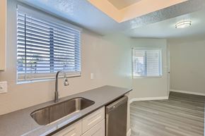 Phoenix apartment for rent - A kitchen with a sink and a window with blinds.