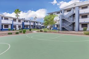 Phoenix apartment for rent - A basketball court is surrounded by apartment buildings.