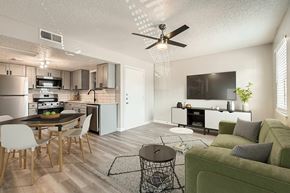 Arlington apartment for rent - A modern kitchen with a dining table and chairs.