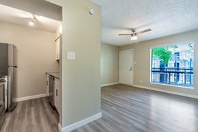 Phoenix apartment for rent - A kitchen with a refrigerator, stove, and oven is shown.