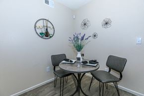 Phoenix apartment for rent - A dining room with a round table and chairs.