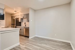 Arlington apartment for rent - A kitchen with a white counter top and a microwave on the wall.