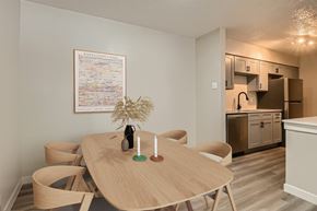 Arlington apartment for rent - A dining area with a wooden table and chairs.