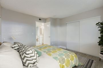 Phoenix apartment for rent - A living room with a white couch and a black and white rug.