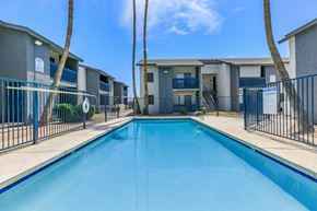 Glendale apartment for rent - A swimming pool in front of a row of apartment buildings.
