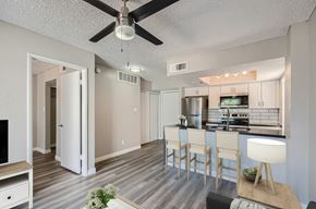 Phoenix apartment for rent - A modern kitchen with a dining table and chairs.