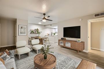 Tempe apartment for rent - A living room with a wooden coffee table and a flat screen TV.