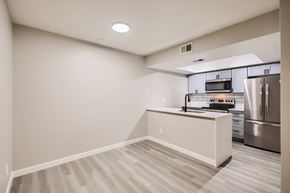 Tempe apartment for rent - A kitchen with a stainless steel refrigerator and a microwave above the stove.