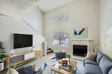 Mesquite apartment for rent - A living room with a grey couch and a coffee table.