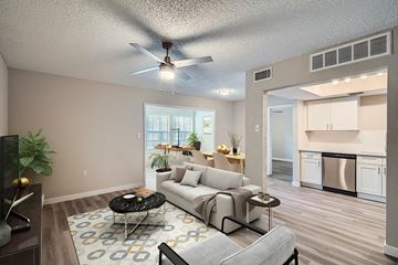 Charlotte apartment for rent - A living room with a grey couch and a black coffee table.