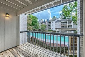 Charlotte apartment for rent - A balcony with a pool in the background.