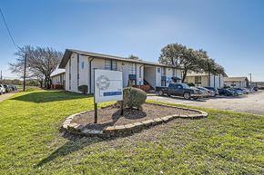 Dallas apartment for rent - A building with a sign that says "The Boulevard" in front of it.