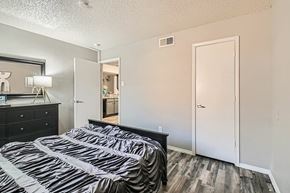 Fort Worth apartment for rent - A bedroom with two beds and a dresser.
