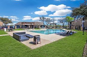 Fort Worth apartment for rent - A pool area with a small pool and a hot tub.