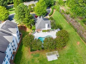 Charlotte apartment for rent - A bird's eye view of a house with a pool and a tree.