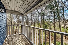 Charlotte apartment for rent - A spacious room with a ceiling fan and carpeted floor.