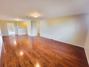 Killeen house for rent - A room with wooden floors and white walls.