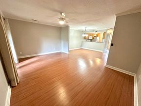 Simpsonville house for rent - A room with wooden flooring and a ceiling fan.
