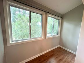 Simpsonville house for rent - A room with a window and wooden flooring.