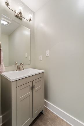 Sneads Ferry house for rent - A bathroom with a sink and a mirror.