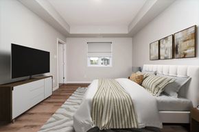Brandon apartment for rent - A bedroom with a bed, a television, and a window.